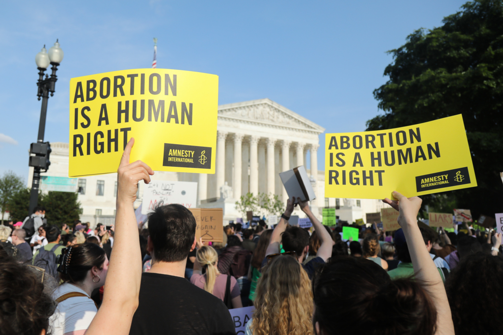 Women holding Amnesty placards that read Abortion is a Human Rights at a demonstration in Washington, DC.